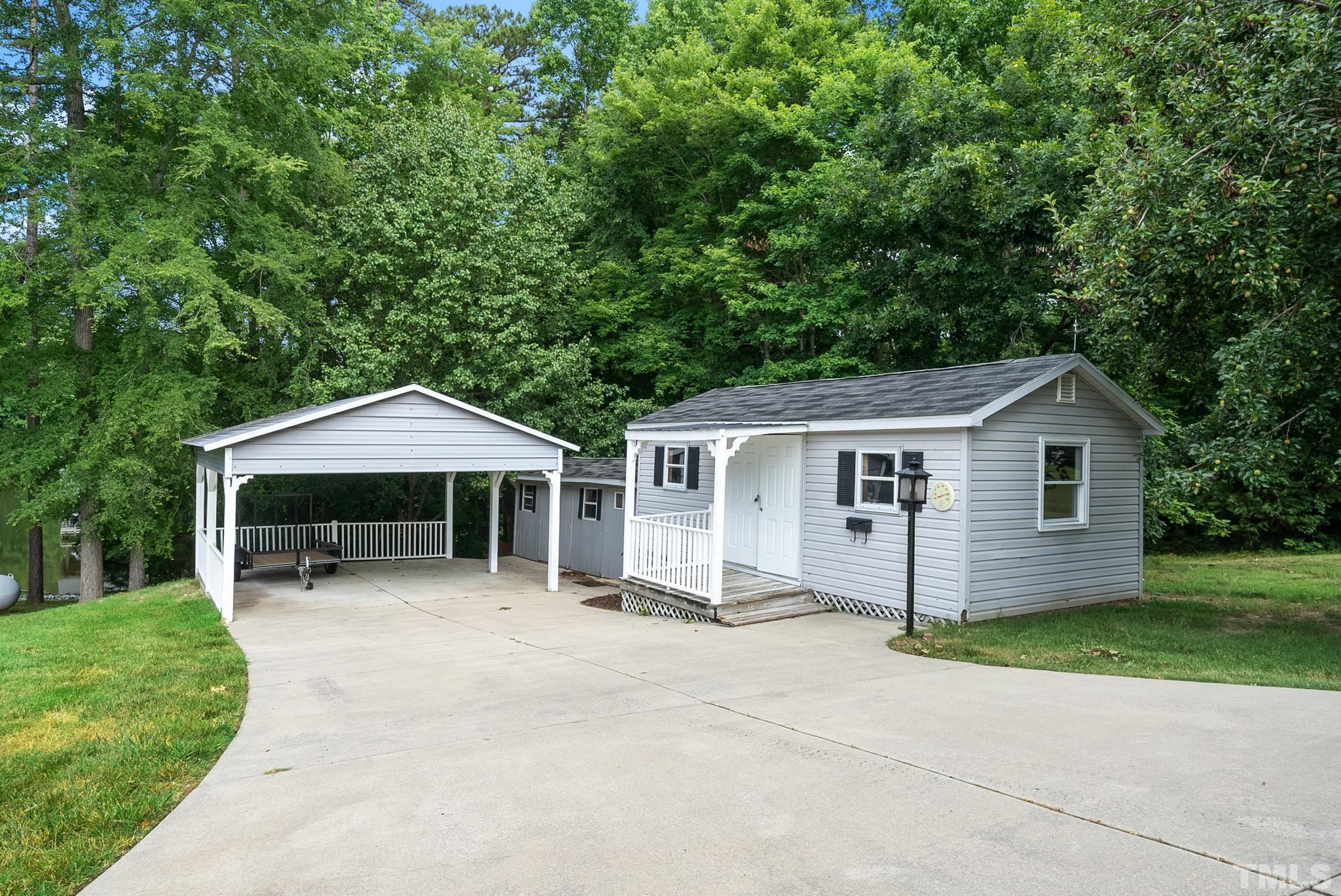 339 Velvet Road Semora, NC 27343 - Photo 67 of 68 a front view of a house with a yard and garage