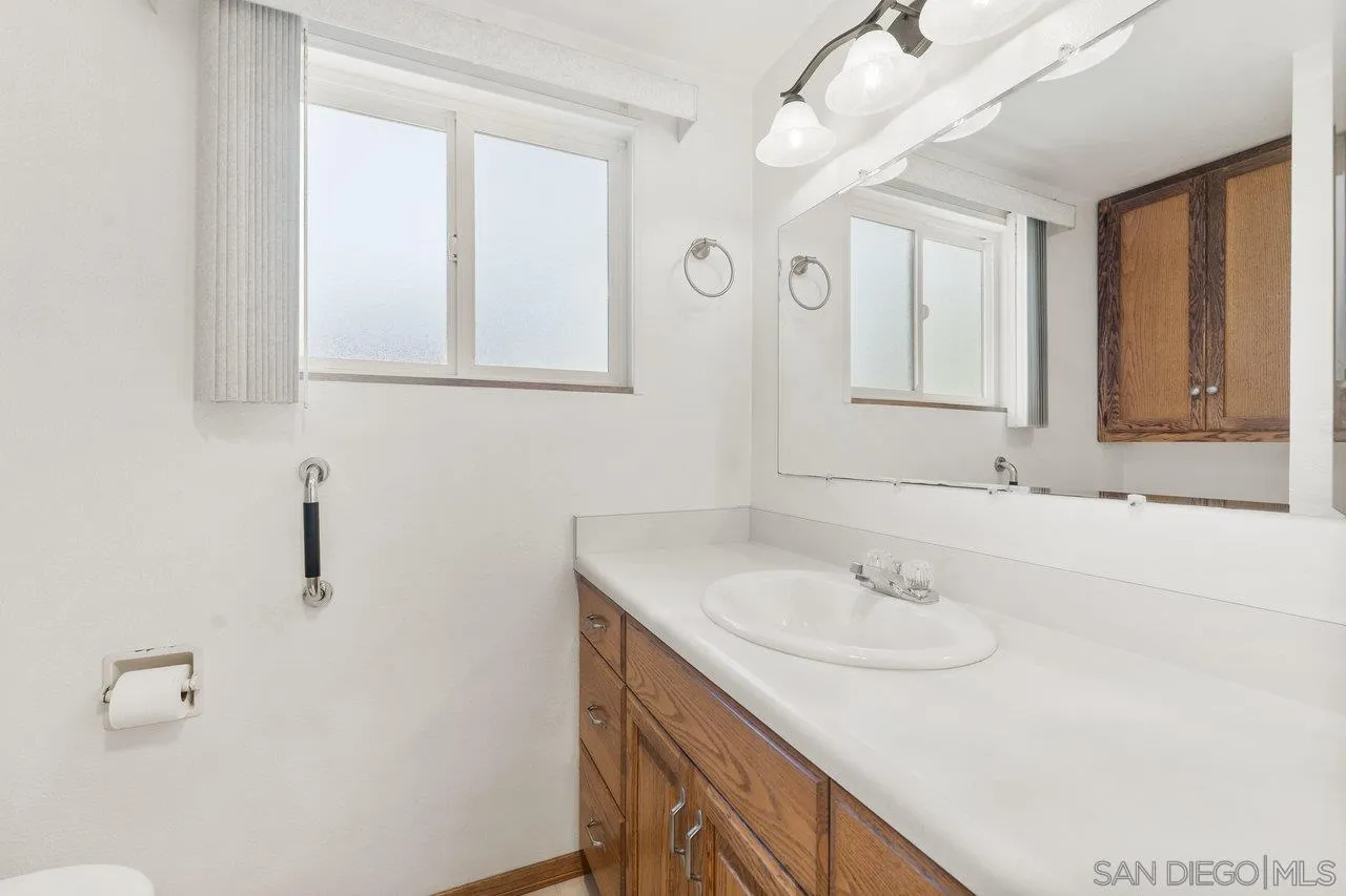 1822 Wight Way El Cajon, CA 92021 - Photo 22 of 45 a bathroom with a sink and a mirror