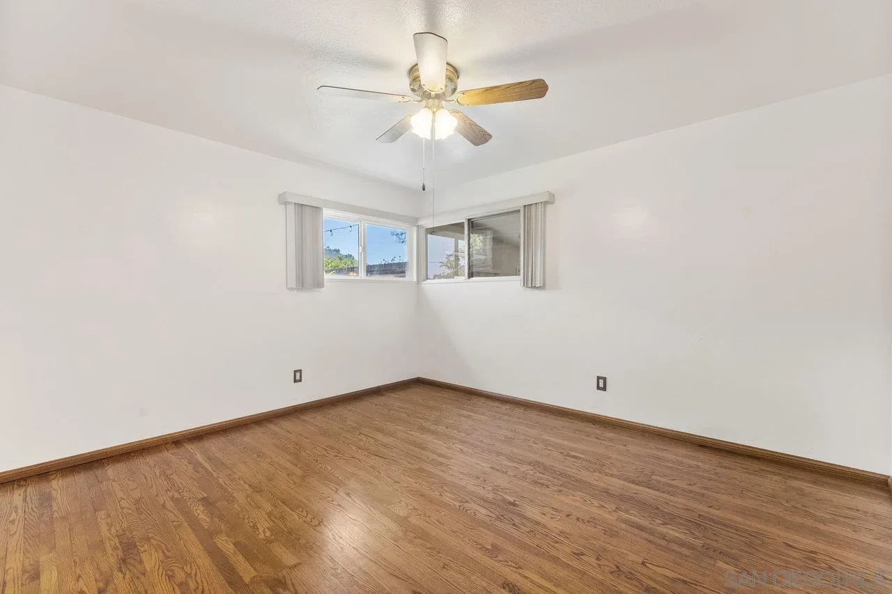 1822 Wight Way El Cajon, CA 92021 - Photo 23 of 45 wooden floor in an empty room with a window