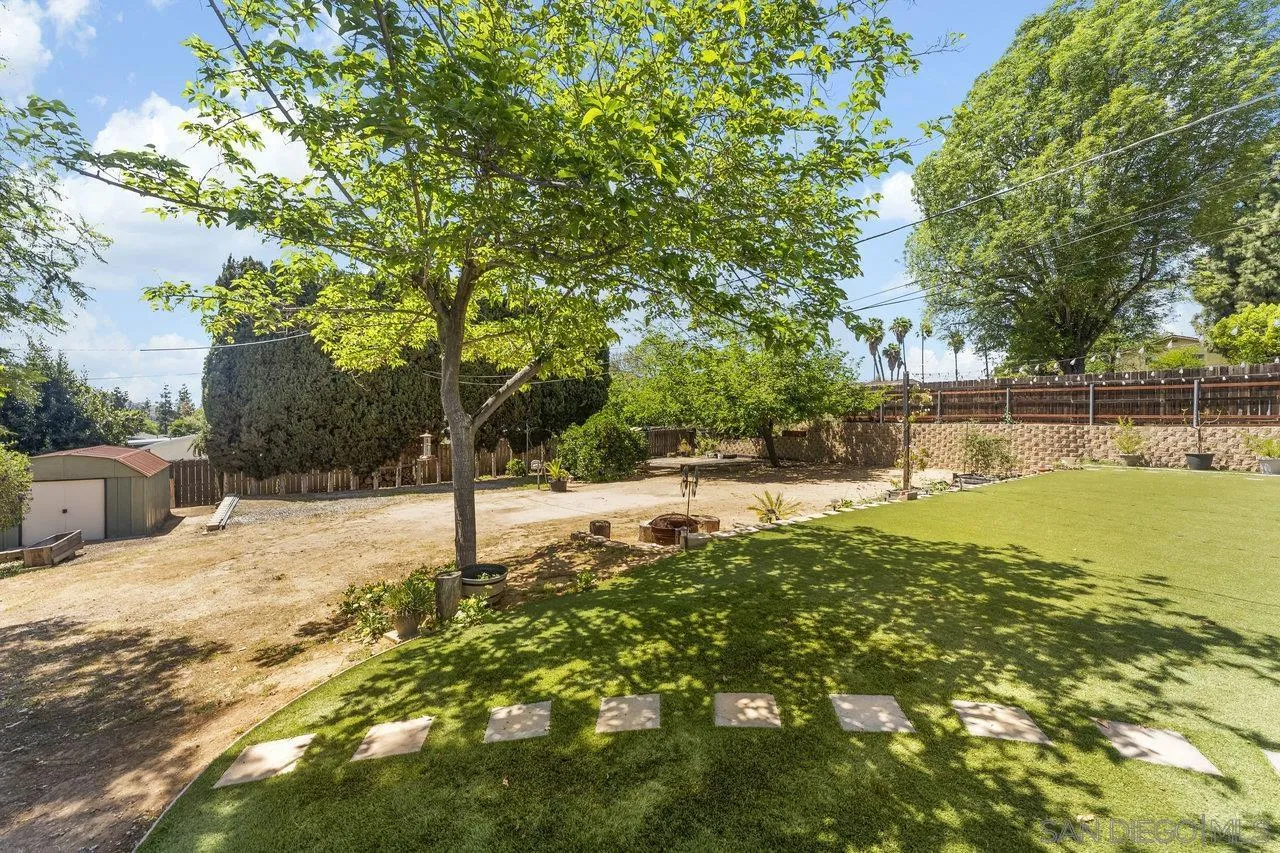 1822 Wight Way El Cajon, CA 92021 - Photo 30 of 45 a swimming pool with trees in the background