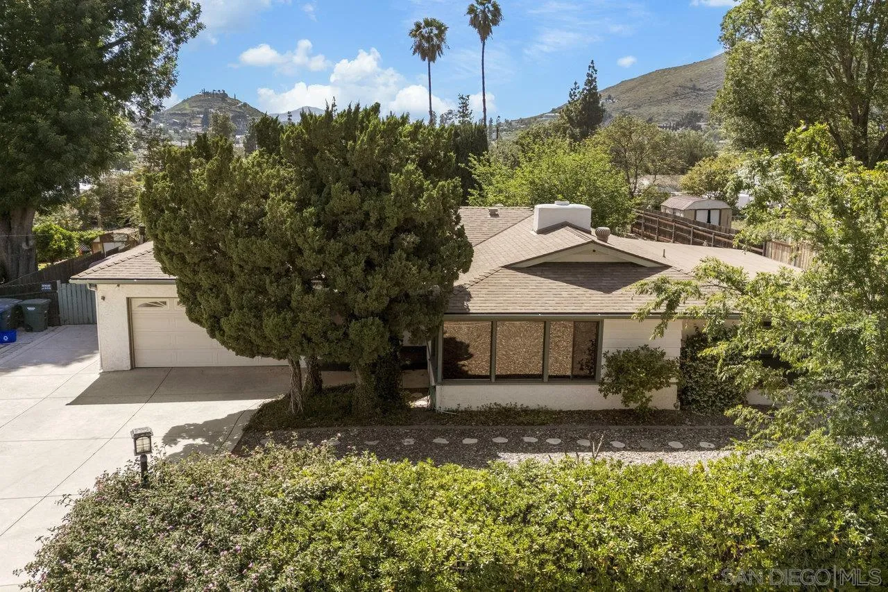 1822 Wight Way El Cajon, CA 92021 - Photo 42 of 45 a view of a house with a yard and hanging chair
