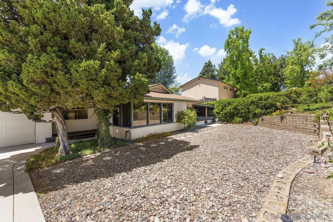 1822 Wight Way El Cajon, CA 92021 - Photo 43 of 45 a front view of a house with a garden and porch