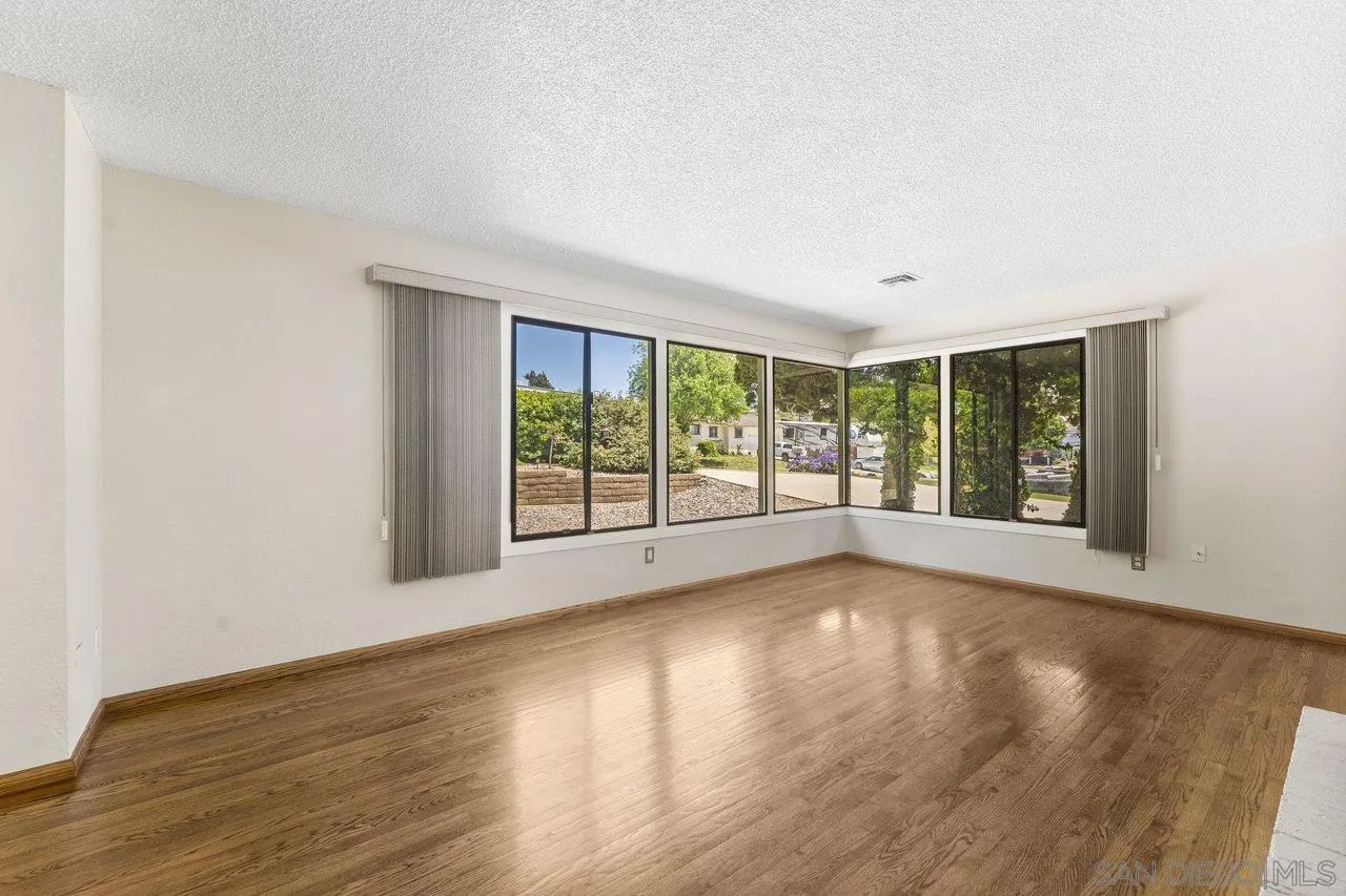 1822 Wight Way El Cajon, CA 92021 - Photo 10 of 45 a view of room with window and hardwood floor