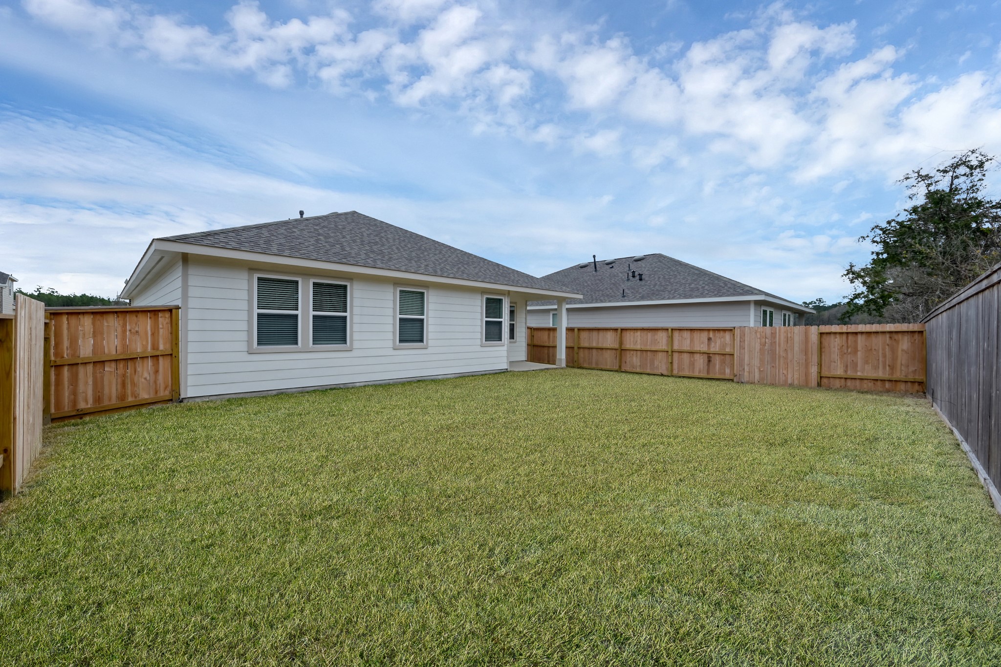 516 Monarch Trail Huntsville, TX 77340 - Photo 20 of 20 a backyard of a house with lots of green space
