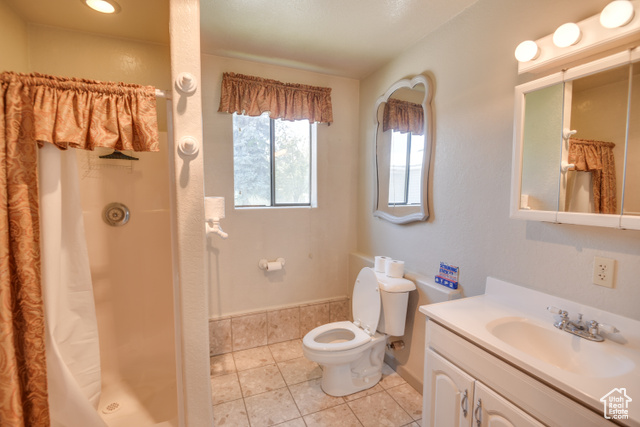 2373 East 190 North Beaver, UT 84713 - Photo 22 of 54 Bathroom with vanity, light tile patterned flooring, and a stall shower
