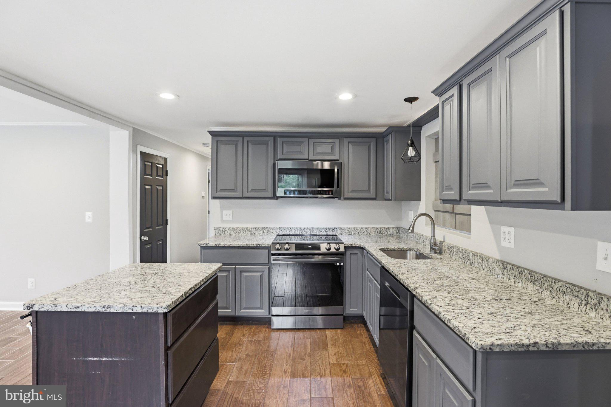 941 Pat Lane Huntingtown, MD 20639 - Photo 7 of 30 Modern kitchen with sleek finishes.