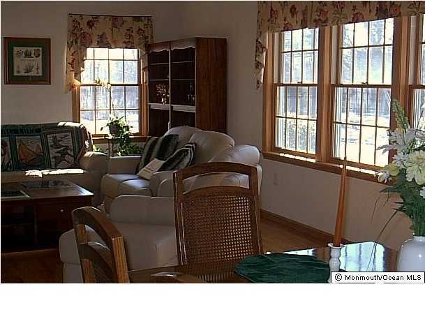1218 Ocean Road Spring Lake Heights, NJ 07762 - Photo 3 of 3 a living room with furniture and a window