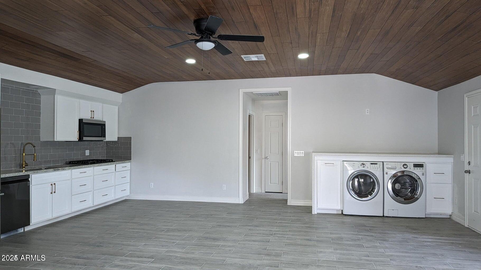 224 South Adonis Avenue Miami, AZ 85539 - Photo 3 of 13 a view of a livingroom with washer and dryer