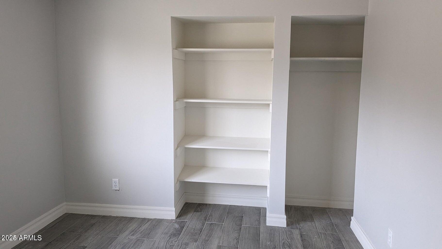 224 South Adonis Avenue Miami, AZ 85539 - Photo 9 of 13 a view of walk in closet with empty racks