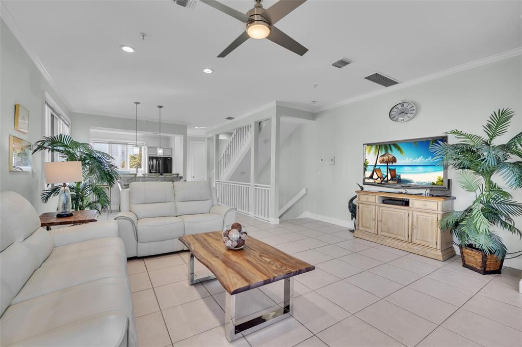 848 Evergreen Way Longboat Key, FL 34228 - Photo 3 of 66 a living room with furniture and a potted plant