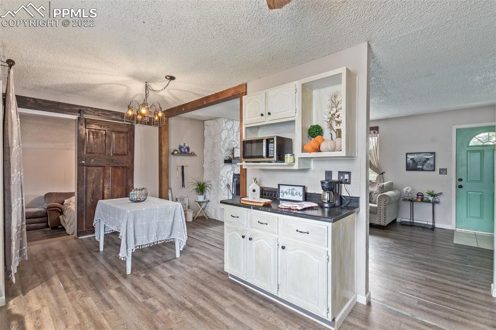 732 South Chestnut Street Elizabeth, CO 80107 - Photo 11 of 26 a living room with furniture and wooden floor