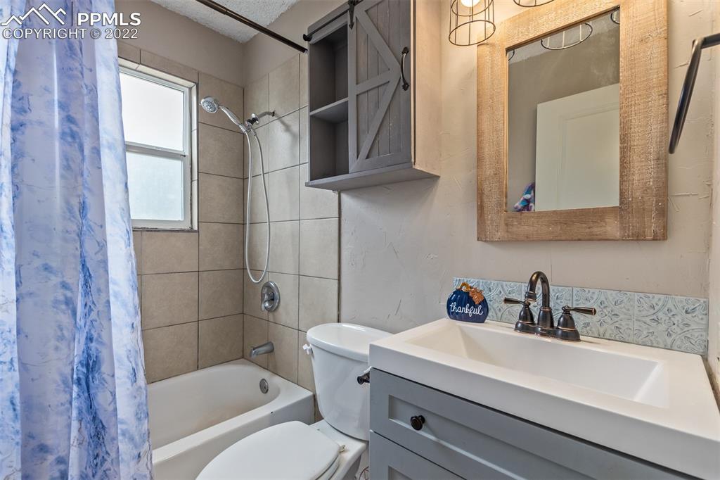 732 South Chestnut Street Elizabeth, CO 80107 - Photo 24 of 26 a bathroom with a sink toilet and shower