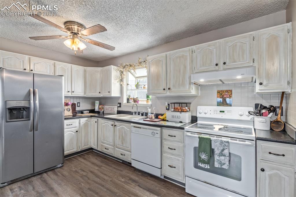 732 South Chestnut Street Elizabeth, CO 80107 - Photo 8 of 26 a kitchen with cabinets stainless steel appliances and a window