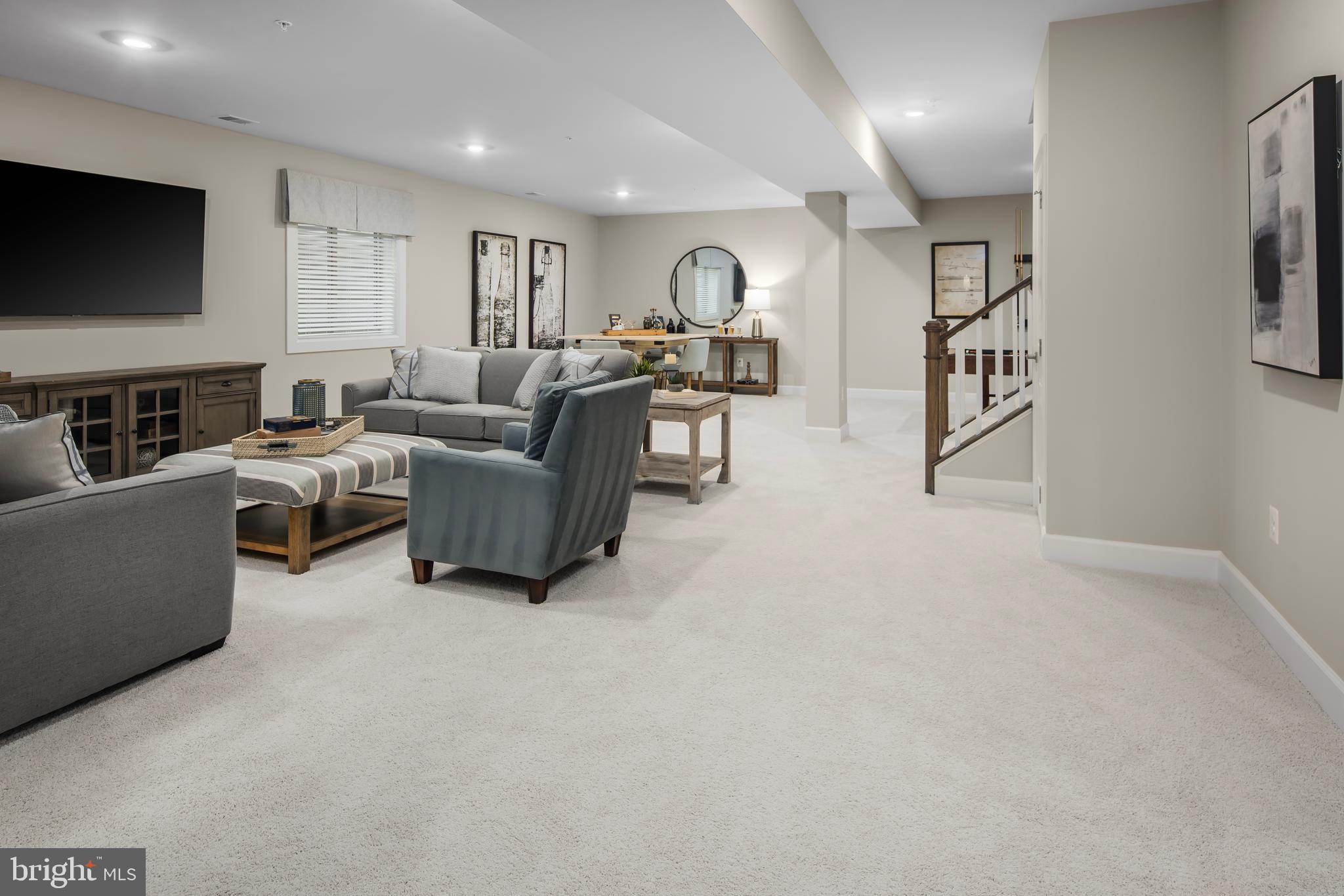 1 Mayapple Lane Frederick, MD 21702 - Photo 14 of 18 a living room with furniture and a flat screen tv