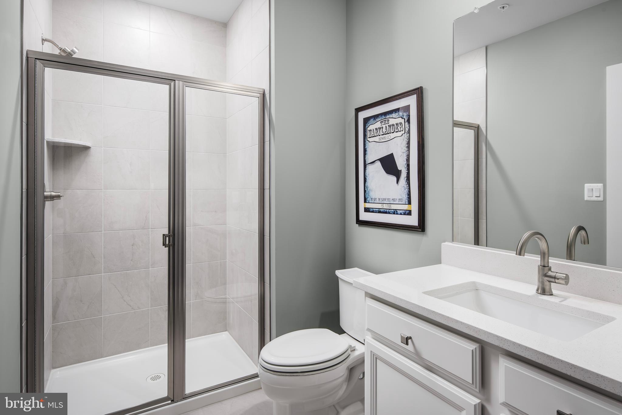 1 Mayapple Lane Frederick, MD 21702 - Photo 17 of 18 a bathroom with a sink a toilet and shower