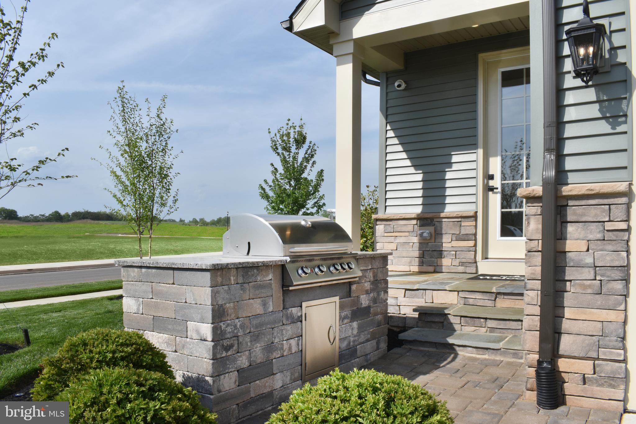 1 Mayapple Lane Frederick, MD 21702 - Photo 18 of 18 a front view of a house with a garden