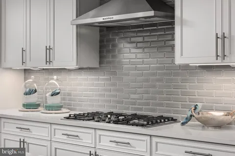 a kitchen with a stove and cabinets