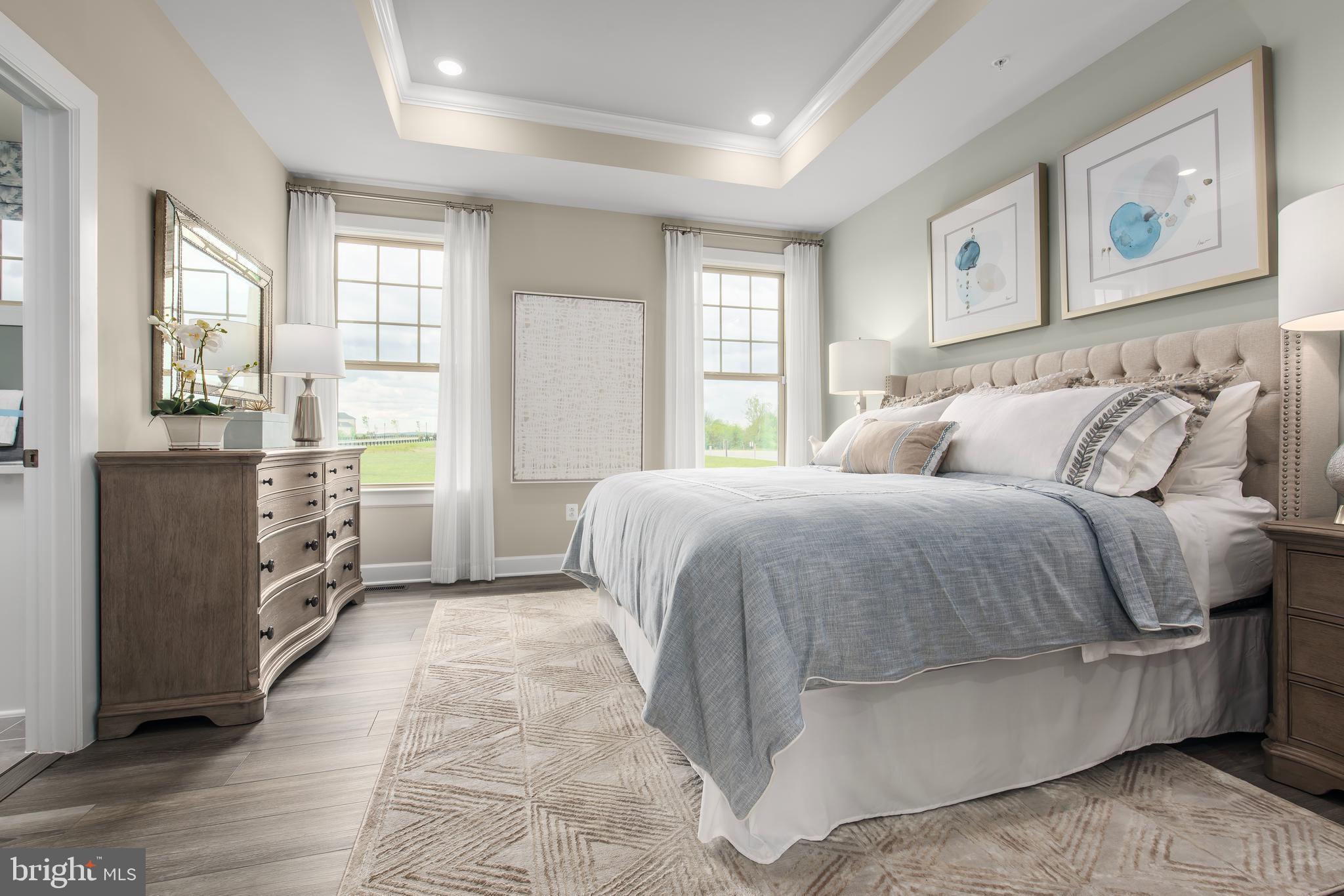 1 Mayapple Lane Frederick, MD 21702 - Photo 8 of 18 a spacious bedroom with a bed and a cabinets