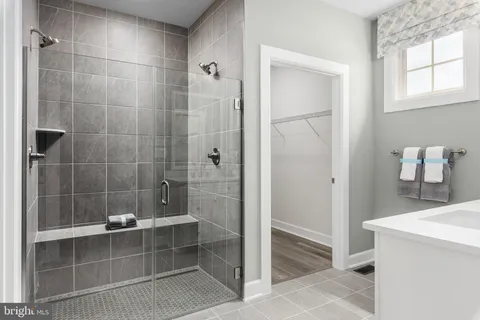 a bathroom with a bathtub and a shower