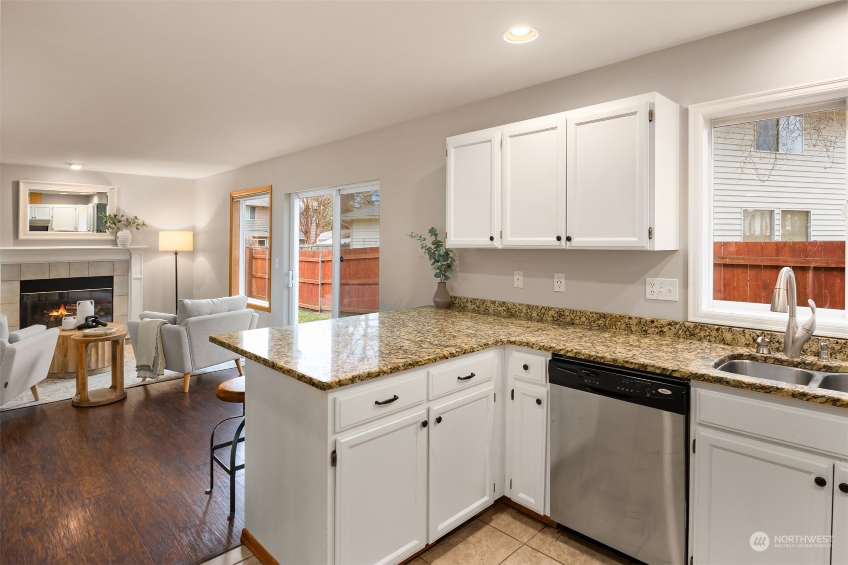8722 Bowdoin Way Edmonds, WA 98026 - Photo 13 of 40 a kitchen that has a lot of cabinets in it and wooden floors