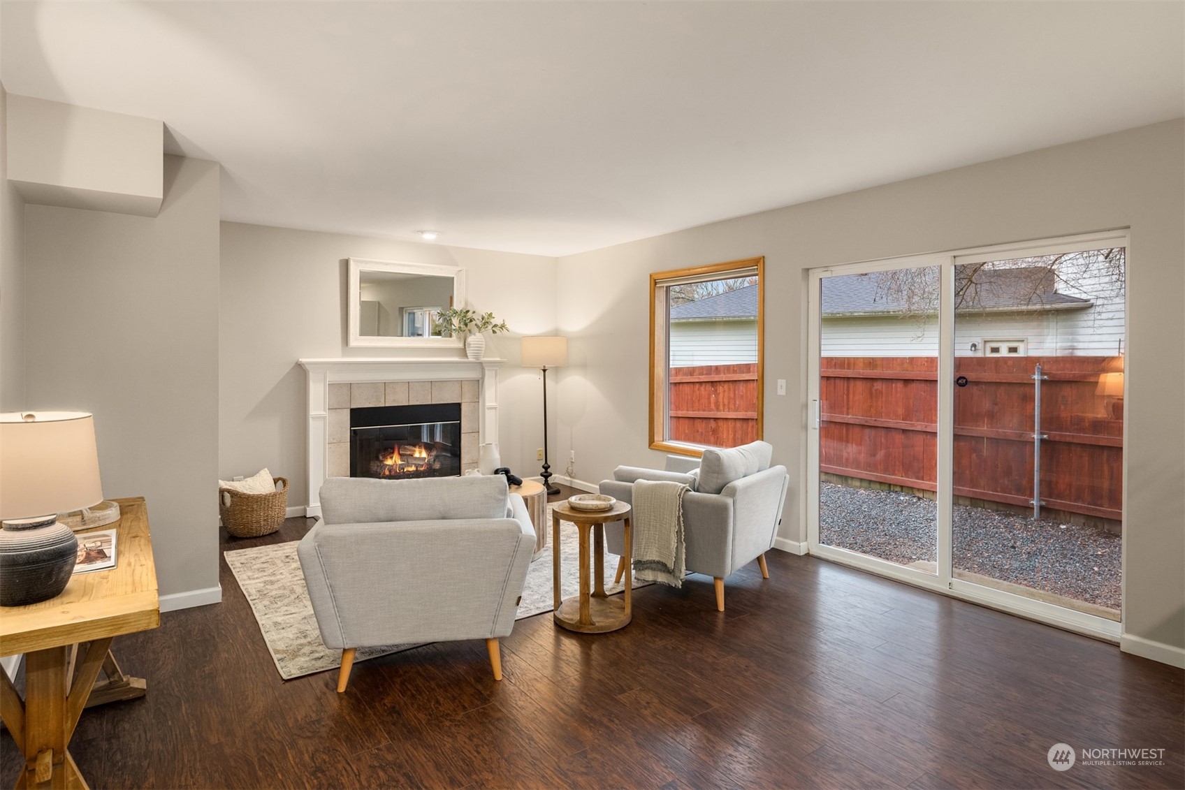8722 Bowdoin Way Edmonds, WA 98026 - Photo 15 of 40 a living room with furniture and a fireplace