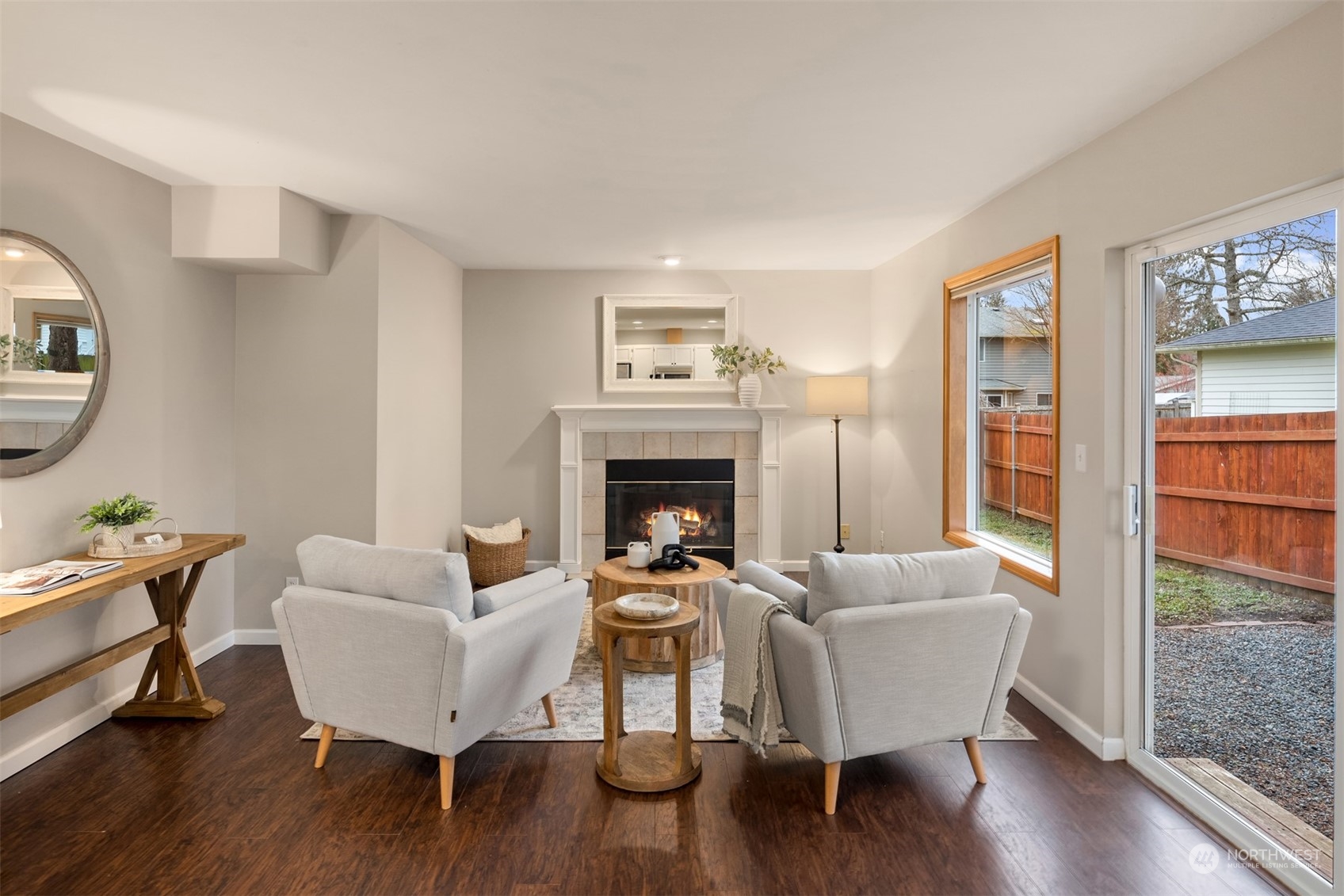 8722 Bowdoin Way Edmonds, WA 98026 - Photo 16 of 40 a living room with furniture a table and wooden floor