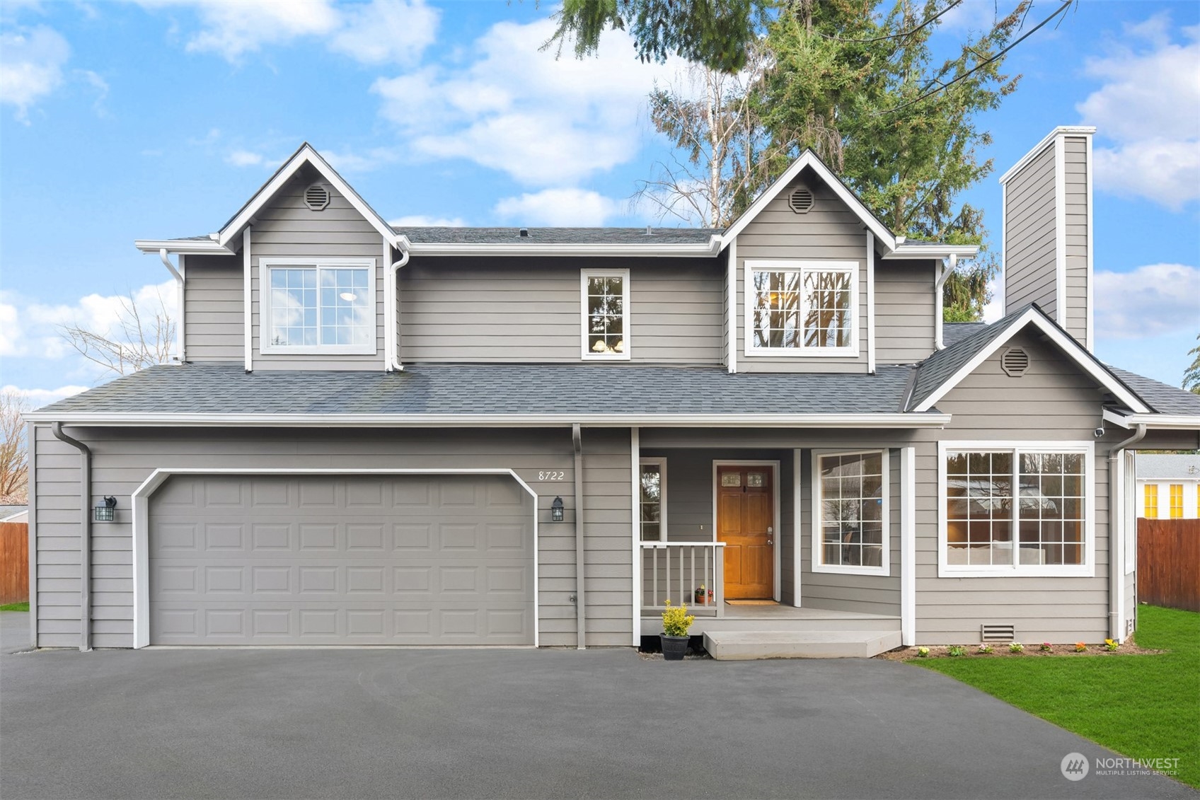 8722 Bowdoin Way Edmonds, WA 98026 - Photo 2 of 40 a front view of a house with a garage