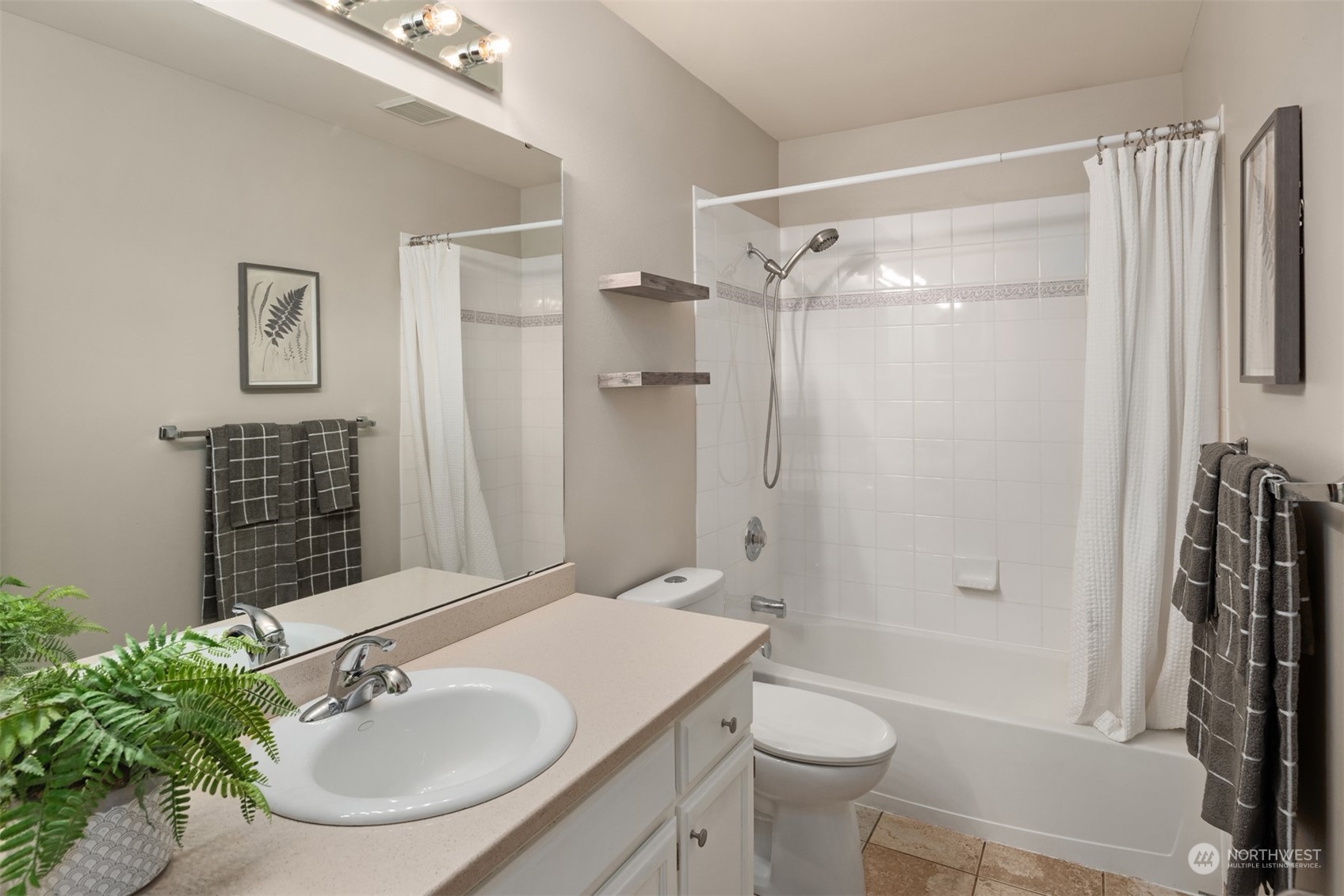 8722 Bowdoin Way Edmonds, WA 98026 - Photo 24 of 40 a bathroom with a sink toilet and shower