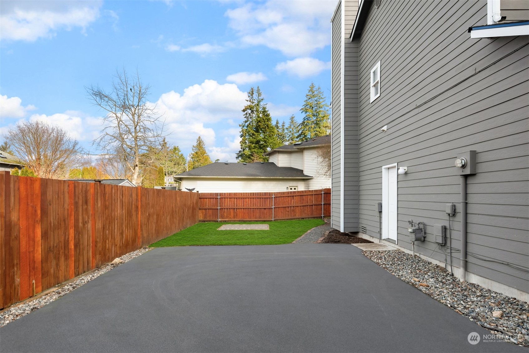 8722 Bowdoin Way Edmonds, WA 98026 - Photo 26 of 40 a backyard of a house with lots of green space