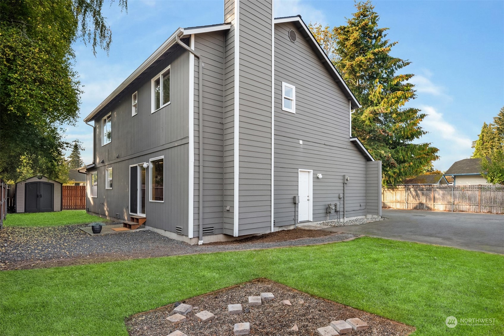 8722 Bowdoin Way Edmonds, WA 98026 - Photo 28 of 40 a backyard of a house with lots of green space