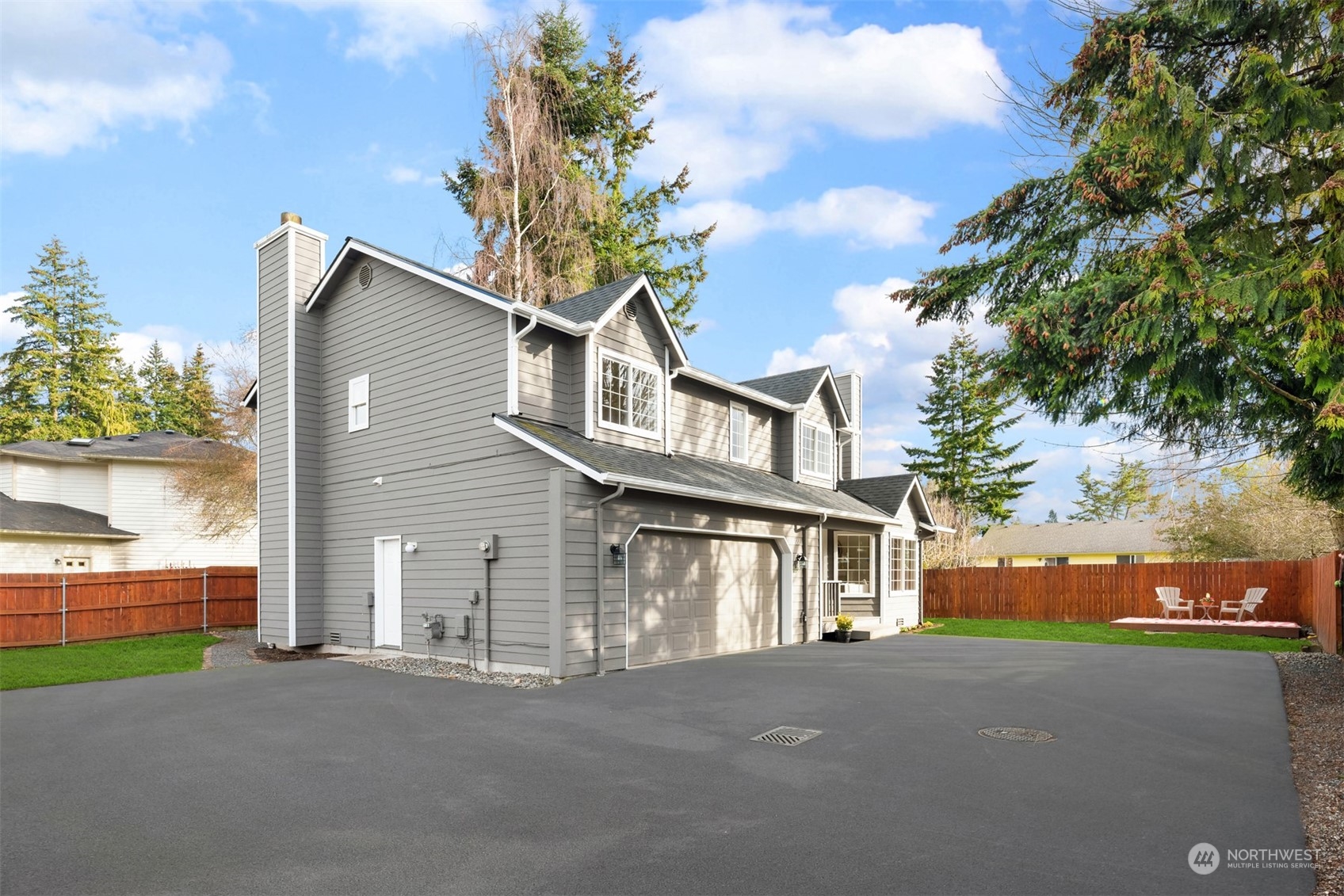 8722 Bowdoin Way Edmonds, WA 98026 - Photo 4 of 40 a front view of a house with a yard and garage