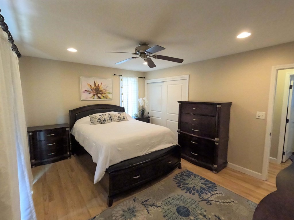262 Flag Swamp Road Dartmouth, MA 02747 - Photo 15 of 23 a bedroom with a bed and a dresser