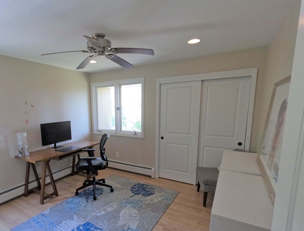262 Flag Swamp Road Dartmouth, MA 02747 - Photo 17 of 23 a view of a workspace with furniture and a window