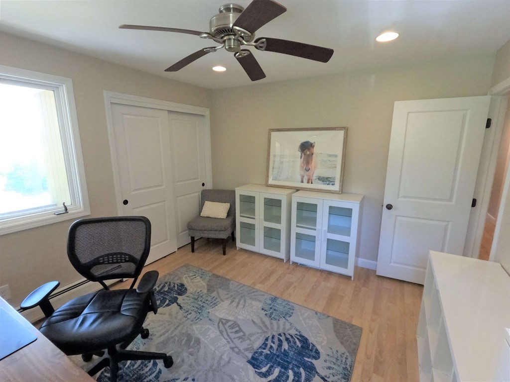 262 Flag Swamp Road Dartmouth, MA 02747 - Photo 18 of 23 a living room with furniture and a chair