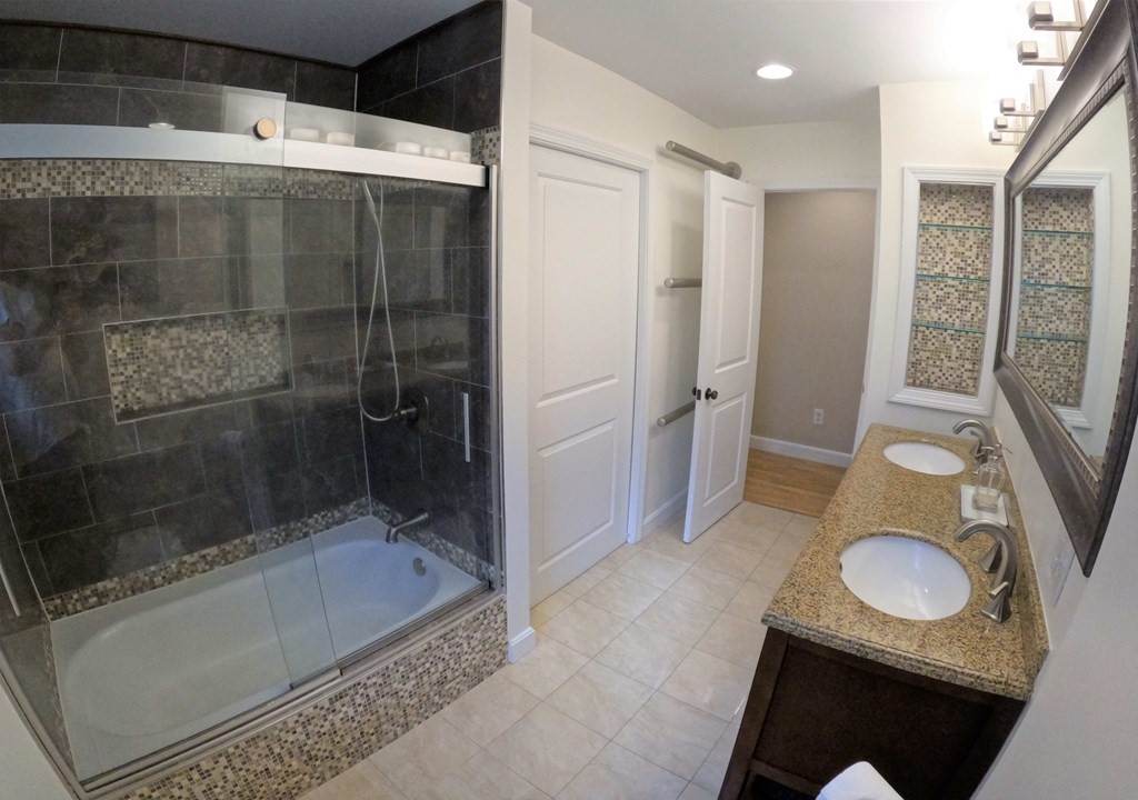 262 Flag Swamp Road Dartmouth, MA 02747 - Photo 21 of 23 a bathroom with a sink and a mirror