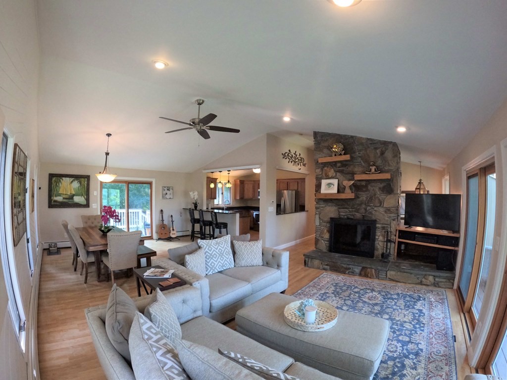 262 Flag Swamp Road Dartmouth, MA 02747 - Photo 9 of 23 a living room with furniture and a fireplace