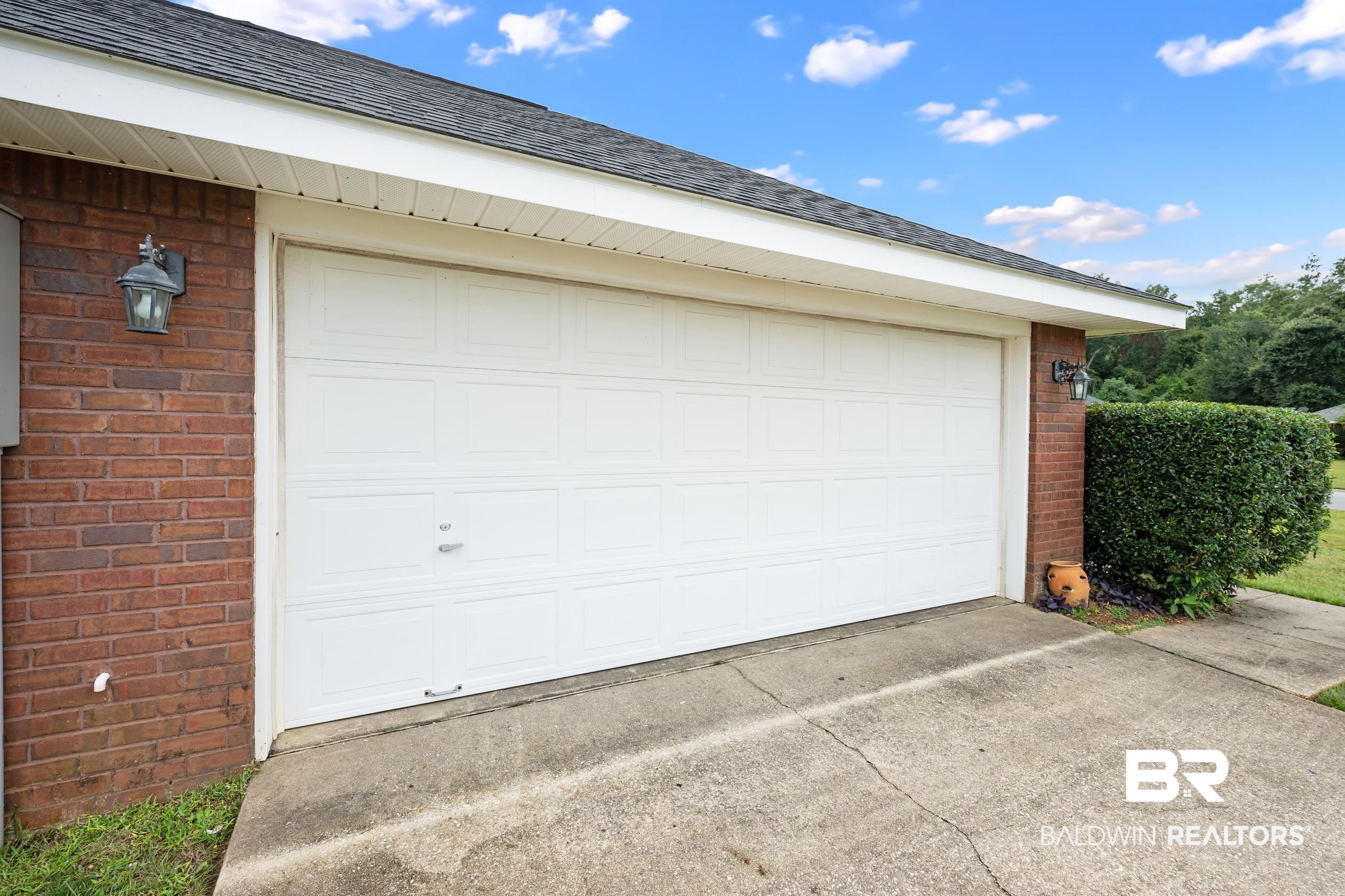 306 Monteith Oaks Drive Foley, AL 36535 - Photo 32 of 38 Garage with concrete driveway