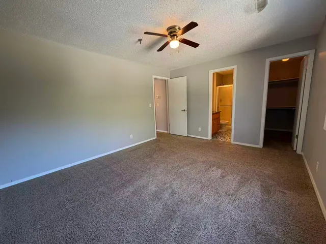 a view of a livingroom with a ceiling fan
