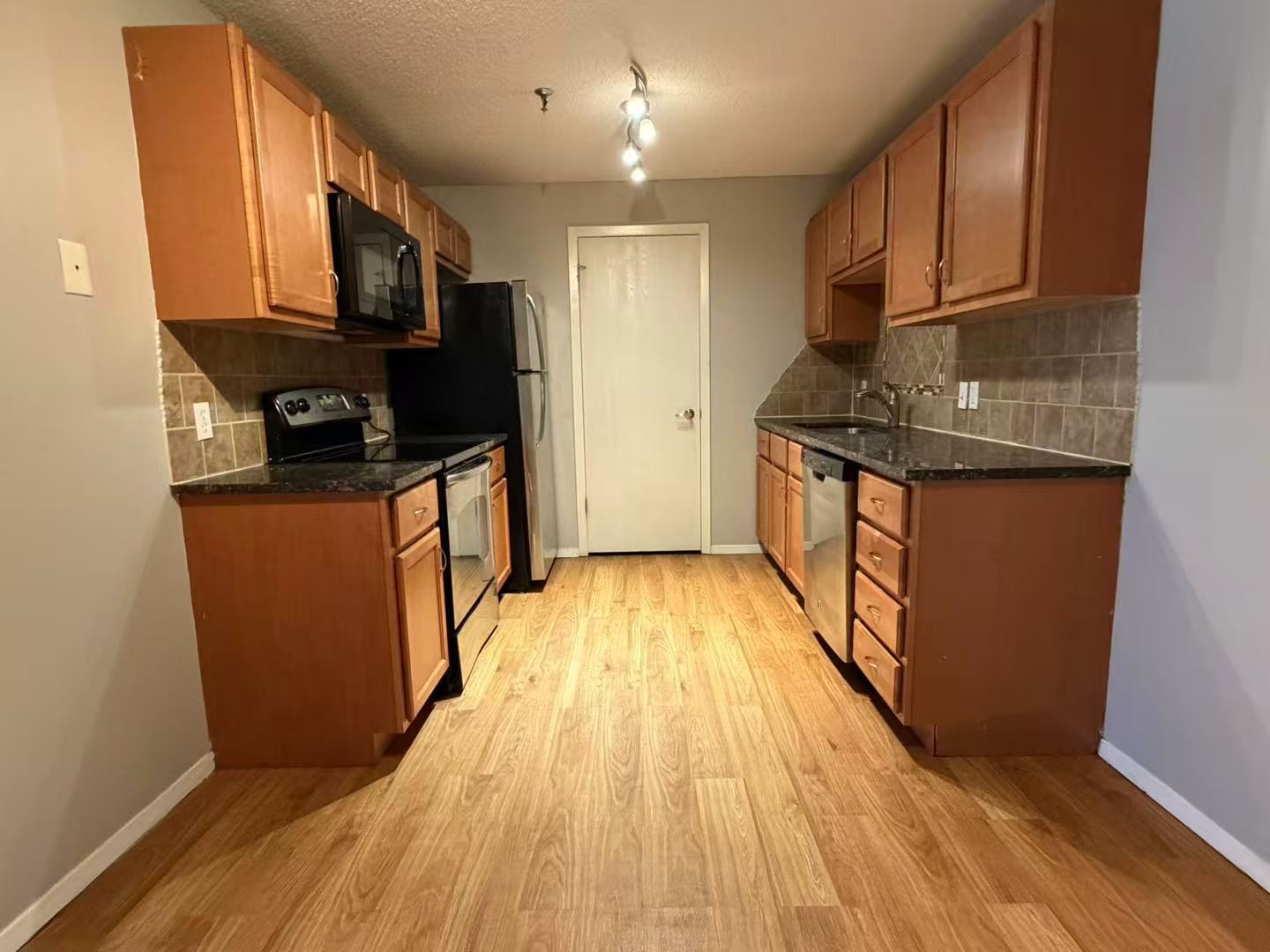 1360 Brook Street, Unit F St. Charles, IL 60174 - Photo 9 of 18 a kitchen with stainless steel appliances granite countertop a stove a sink and a refrigerator