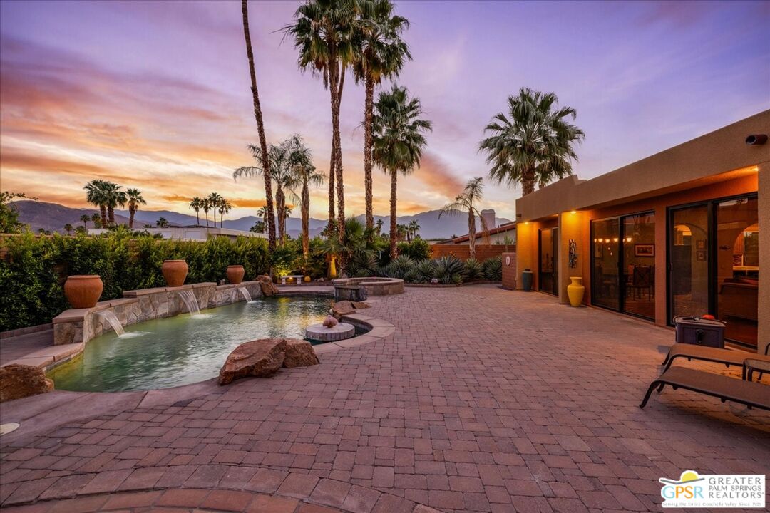 71121 Sunny Lane Rancho Mirage, CA 92270 - Photo 1 of 75 a view of a patio with swimming pool and sitting area