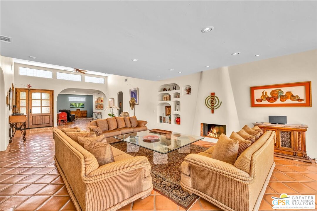 71121 Sunny Lane Rancho Mirage, CA 92270 - Photo 19 of 75 a living room with fireplace furniture and a flat screen tv