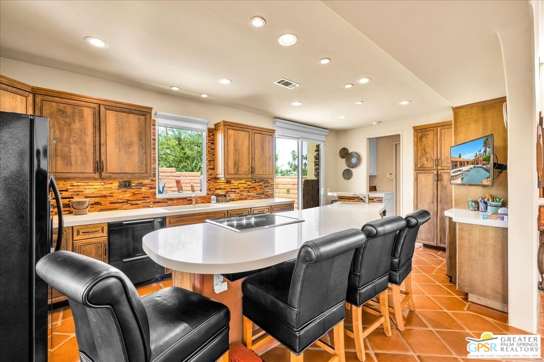 71121 Sunny Lane Rancho Mirage, CA 92270 - Photo 20 of 75 a view of a dining room with furniture window and wooden floor