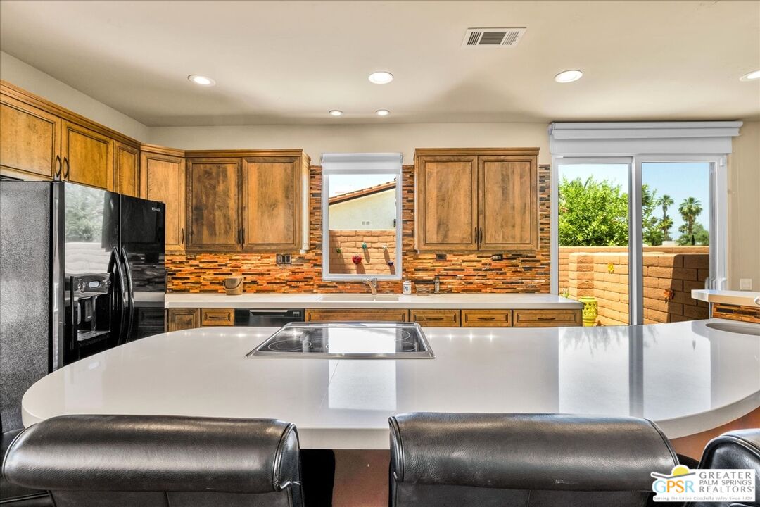 71121 Sunny Lane Rancho Mirage, CA 92270 - Photo 21 of 75 a kitchen with a sink and large window