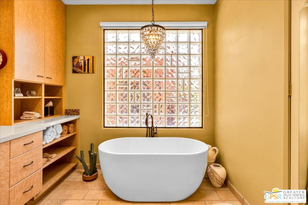 71121 Sunny Lane Rancho Mirage, CA 92270 - Photo 36 of 75 a bathroom with a bathtub and next to a window