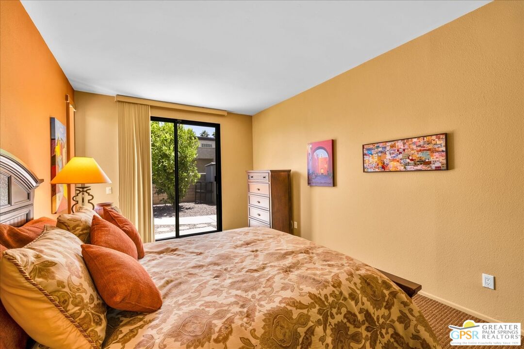 71121 Sunny Lane Rancho Mirage, CA 92270 - Photo 41 of 75 a bedroom with a bed and a large window