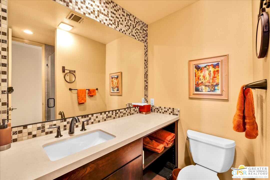 71121 Sunny Lane Rancho Mirage, CA 92270 - Photo 43 of 75 a bathroom with a sink mirror and toilet