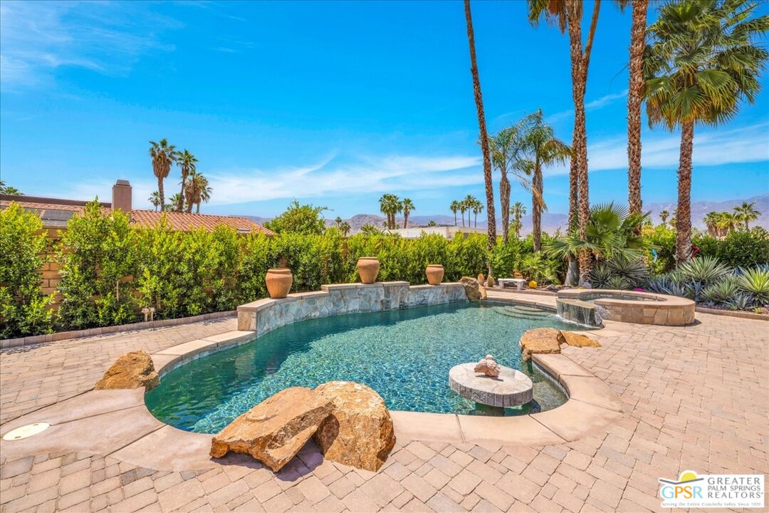 71121 Sunny Lane Rancho Mirage, CA 92270 - Photo 46 of 75 a view of a backyard with plants and palm tree