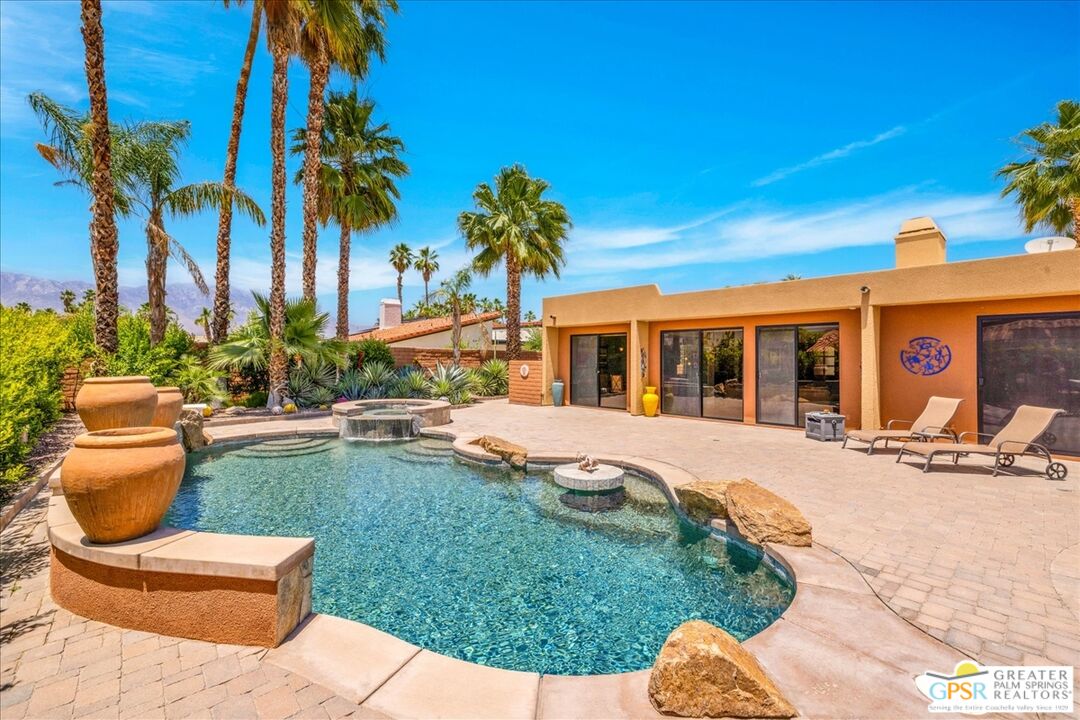 71121 Sunny Lane Rancho Mirage, CA 92270 - Photo 48 of 75 a view of a backyard with swimming pool and sitting area