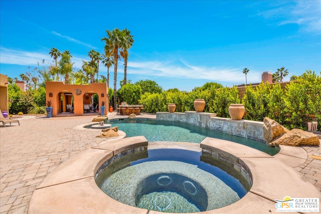 71121 Sunny Lane Rancho Mirage, CA 92270 - Photo 5 of 75 a view of a swimming pool with a patio