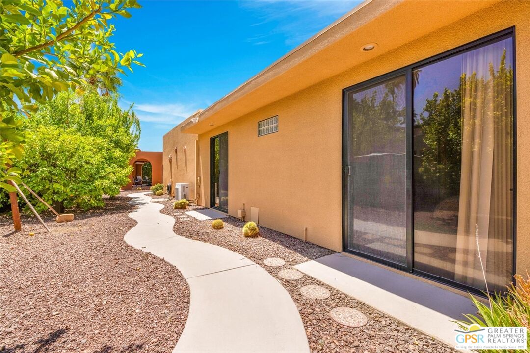 71121 Sunny Lane Rancho Mirage, CA 92270 - Photo 58 of 75 a front view of a house with a yard